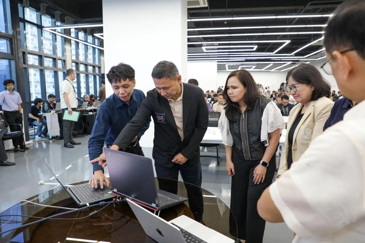 DepEd officials being walked through the LIGTAS+ platform on laptops at the nationwide launch