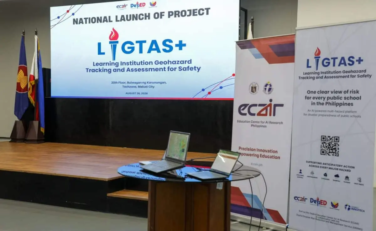 The National Launch of Project LIGTAS+ stage in Makati City, with the title slide and ECAIR and LIGTAS+ banners beside laptops running the platform